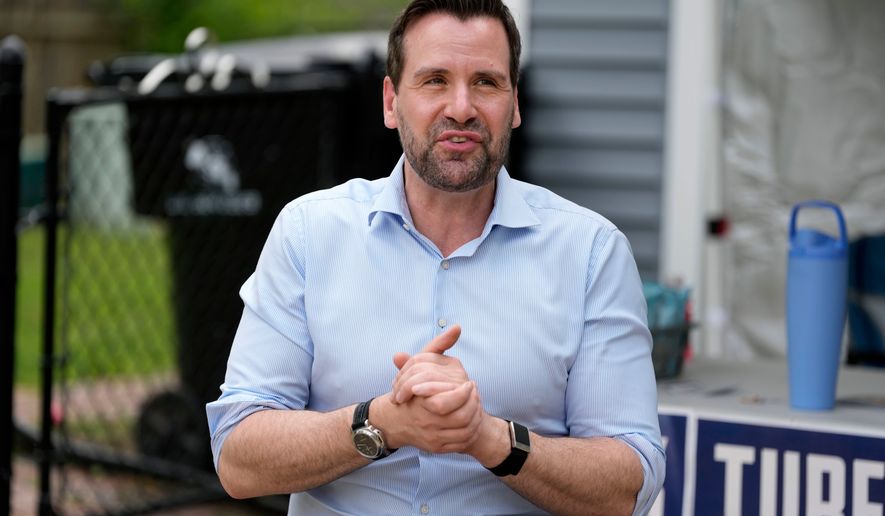 Iowa state Rep. Josh Turek, a Democratic candidate for U.S. Senate, speaks to supporters before a canvassing event, Sunday, May 31, 2026, in Waukee, Iowa. (AP Photo/Charlie Neibergall)