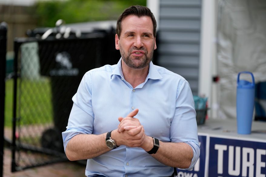 Iowa state Rep. Josh Turek, a Democratic candidate for U.S. Senate, speaks to supporters before a canvassing event, Sunday, May 31, 2026, in Waukee, Iowa. (AP Photo/Charlie Neibergall)