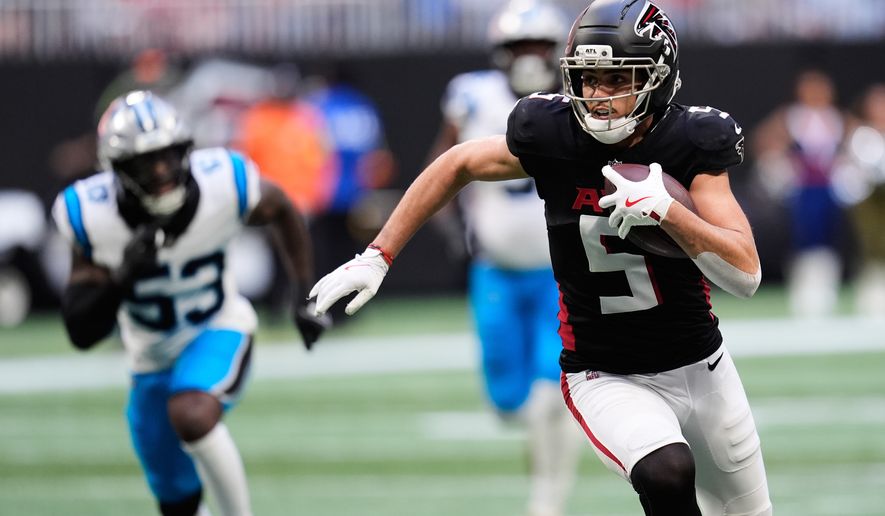 FILE - Atlanta Falcons wide receiver Drake London (5) carries against the Carolina Panthers in the first half of an NFL football game, Nov. 16, 2025, in Atlanta. (AP Photo/Mike Stewart, File)