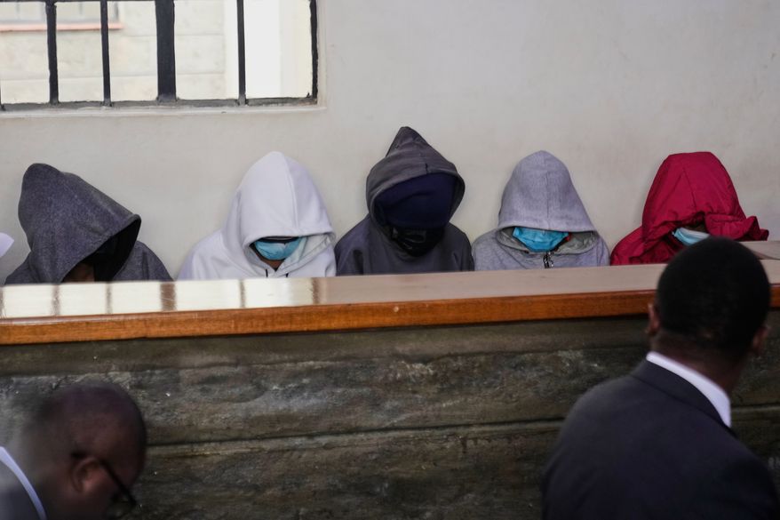 Students from Utumishi Girls Academy appear at Naivasha Law Courts in Nakuru, Kenya, Tuesday, June 2, 2026. (AP Photo/Brian Inganga)