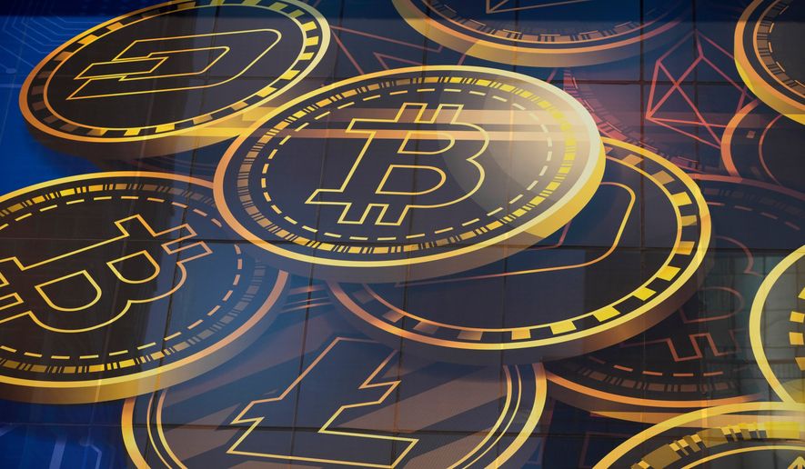 An advertisement for the cryptocurrency Bitcoin is displayed on a building in Hong Kong on Nov. 18, 2021. (AP Photo/Kin Cheung, File)