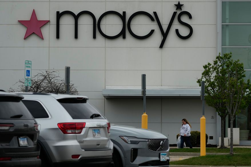 FILE - A Macy's sign is displayed outside the department store in Gurnee, Ill., Wednesday, April 15, 2026. (AP Photo/Nam Y. Huh, file)