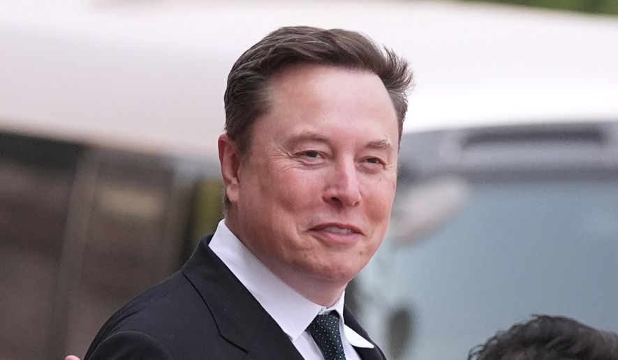 Elon Musk departs after a welcome ceremony with President Donald Trump and China's President Xi Jinping at the Great Hall of the People, Thursday, May 14, 2026, in Beijing. (AP Photo/Mark Schiefelbein, File)