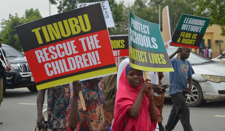 Children protest demanding government to rescue the school children who were recently kidnapped in various part of the country, on the street of Abuja, Nigeria. Thursday, June 4, 2026. (AP Photo/Olamikan Gbemiga)