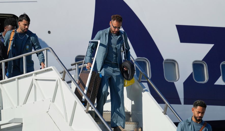 Brazilian soccer player Neymar disembarks at Newark Liberty International Airport in Newark, N.J., Tuesday, June 2, 2026, as the team arrives ahead of the World Cup soccer tournament. (AP Photo/Seth Wenig)