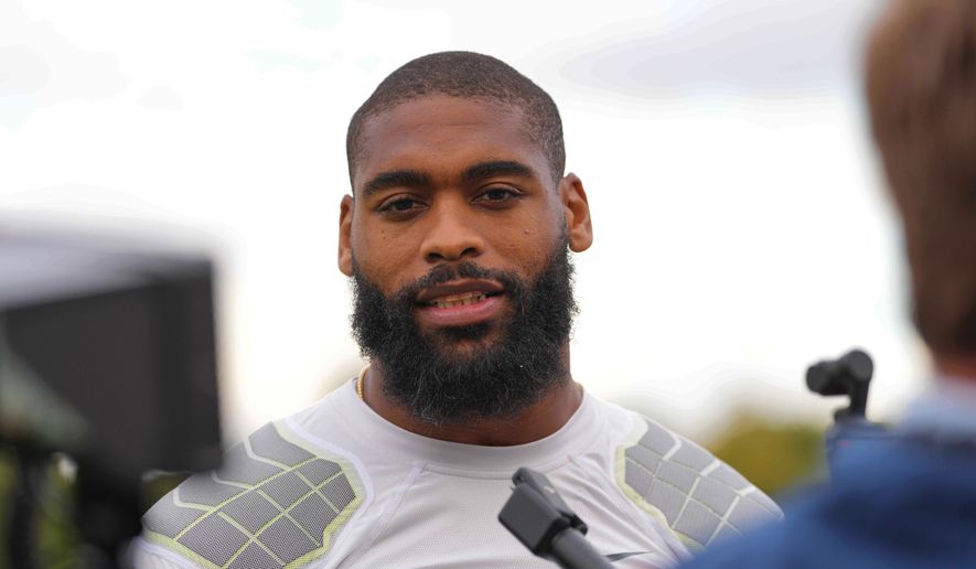 Denver Broncos' Jonathon Cooper speaks to the media at NFL football practice at Tottenham Hotspur training ground in London, Wednesday, Oct. 8, 2025. (AP Photo/Kirsty Wigglesworth, File)