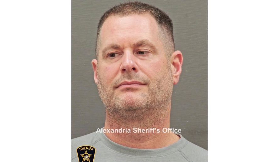 In this image provided and annotated by the Alexandria's Sheriff's Office, David J. Rush is seen in his booking photo in Alexandria, Va. (Alexandria Sheriff via AP)