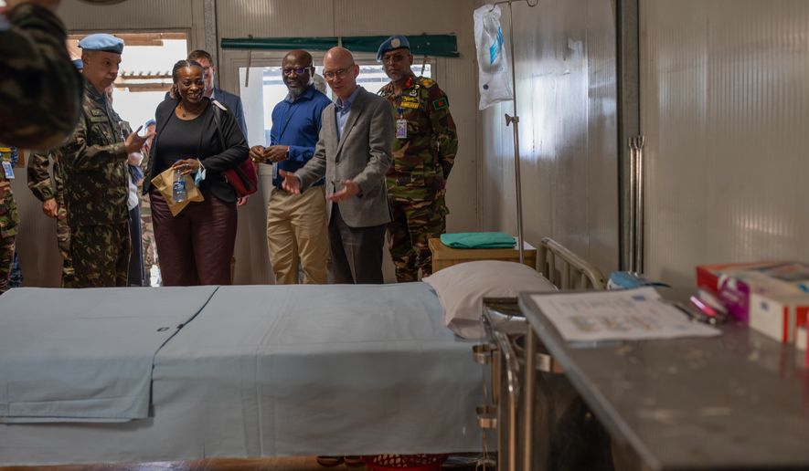 Head of the UN mission in Congo James Swan visits an Ebola treatment center in Bunia, Congo, Thursday, June 4, 2026. (AP Photo/Moses Sawasawa)