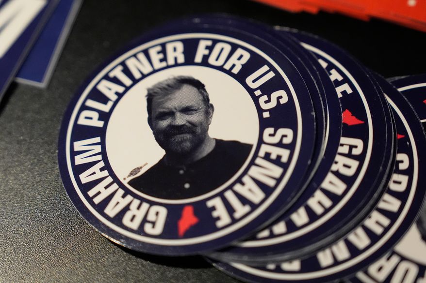 Stickers for Graham Platner, Democratic candidate for U.S. Senate, are displayed at campaign event Friday, June 5, 2026, in Bar Harbor, Maine. (AP Photo/Robert F. Bukaty)