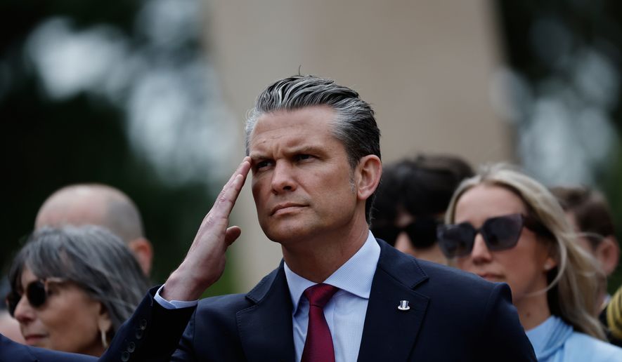 U.S. Defense Secretary Pete Hegseth salutes during a ceremony at the US cemetery to commemorate the 82nd anniversary of the D-Day, in Colleville-sur-Mer, Normandy, France, Saturday, June 6, 2026. (AP Photo/Jeremias Gonzalez)