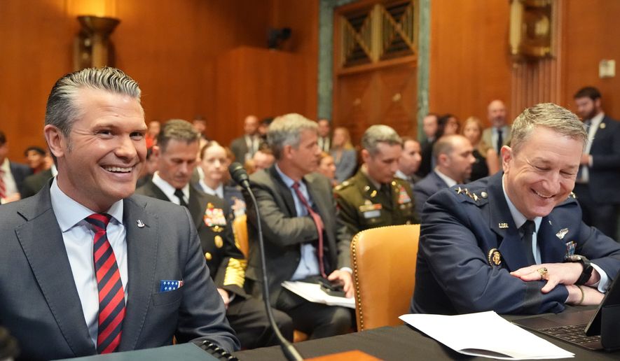 Defense Secretary Pete Hegseth and Chairman of the Joint Chiefs of Staff Gen. Dan Caine arrive for a Senate Appropriations subcommittee on defense hearing on the budget request for the Department of Defense, Tuesday, May 12, 2026, in Washington. (AP Photo/Alex Brandon)