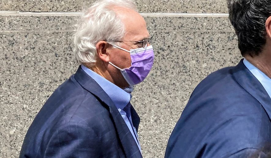 Former U.S. Rep. Stephen Buyer, left, trails his lawyer as he leaves Manhattan federal court after pleading not guilty to charges that he participated in an insider trading scheme while working as a consultant, July 27, 2022, in New York. (AP Photo/Larry Neumeister, File)