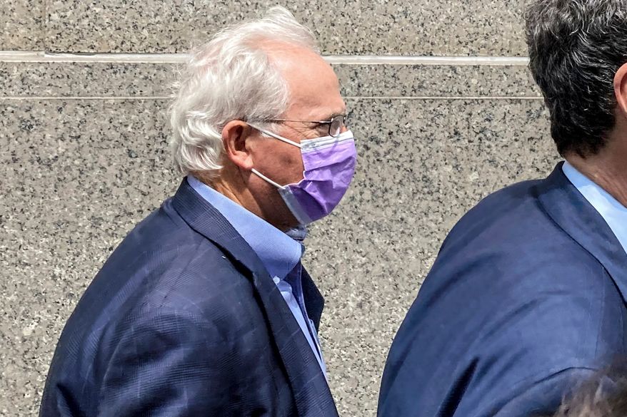 Former U.S. Rep. Stephen Buyer, left, trails his lawyer as he leaves Manhattan federal court after pleading not guilty to charges that he participated in an insider trading scheme while working as a consultant, July 27, 2022, in New York. (AP Photo/Larry Neumeister, File)