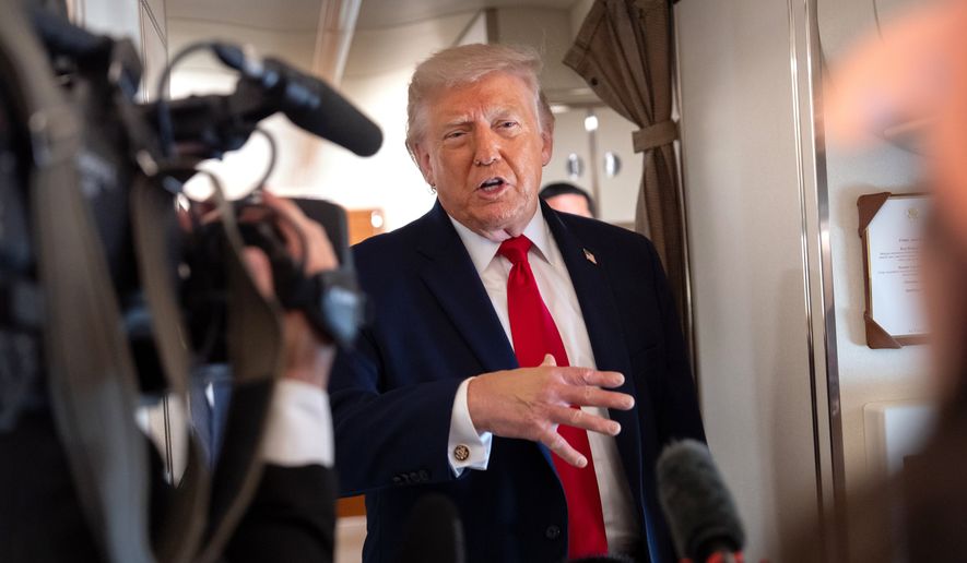 President Donald Trump speaks to reporters aboard Air Force One en route from Joint Base Andrews, Md., to Eau Claire, Wis., Friday, June 5, 2026. (AP Photo/Mark Schiefelbein)