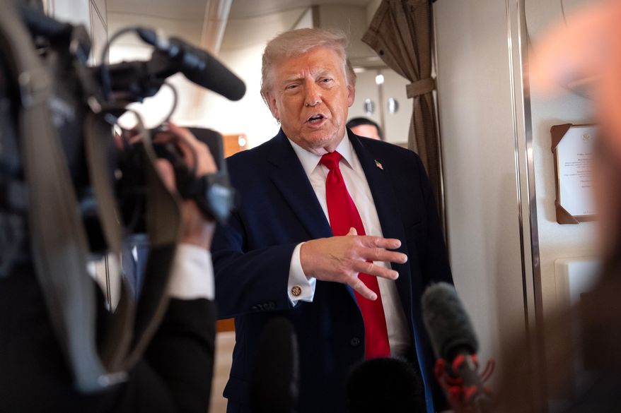 President Donald Trump speaks to reporters aboard Air Force One en route from Joint Base Andrews, Md., to Eau Claire, Wis., Friday, June 5, 2026. (AP Photo/Mark Schiefelbein)