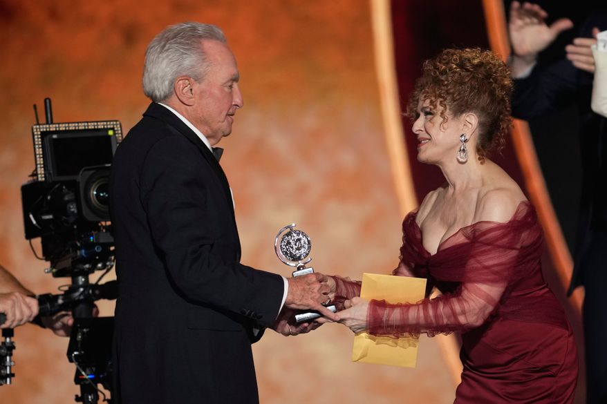 Bernadette Peters, left, presents the award for best musical to Lorne Michaels for "Schmigadoon!" during the 79th Tony Awards on Sunday, June 7, 2026, at Radio City Music Hall in New York. (Photo by Charles Sykes/Invision/AP)