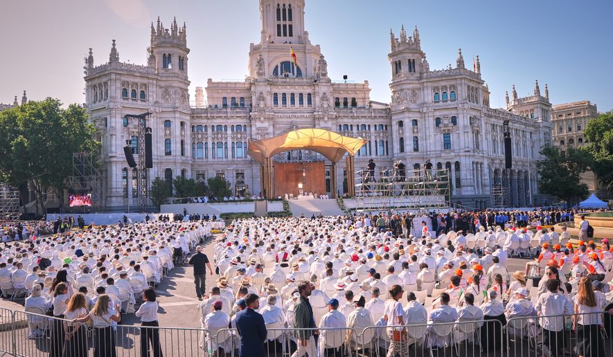 Pope Leo XIV presides over a Mass marking the Catholic feast of Corpus Christi at Plaza de Cibeles in Madrid, Spain, Sunday, June 7, 2026, on the second day of his seven-day apostolic visit to mainland Spain and the Canary Islands. (AP Photo/Manu Fernandez)