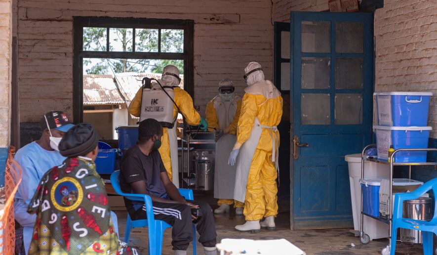 Health workers prepare for duty at the Mongbwalu treatment center in Mongbwalu, Congo, Friday, June 5, 2026. (AP Photo/Moses Sawasawa)