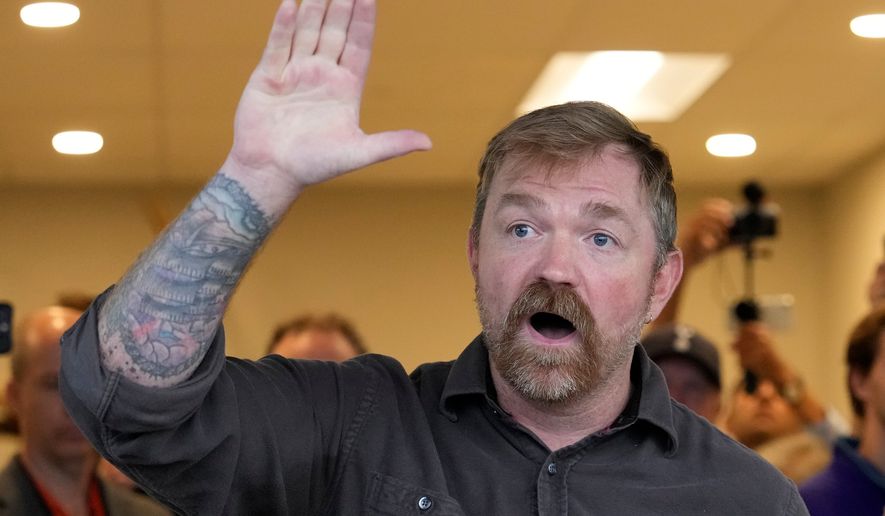 Graham Platner, Democratic candidate for U.S. Senate, speaks to an overflow crowd outside a campaign event Sunday, June 7, 2026, in Portland, Maine. (AP Photo/Robert F. Bukaty)