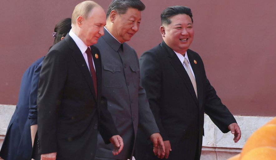 In this photo provided by the North Korean government, Russian President Vladimir Putin, from left, Chinese President Xi Jinping and North Korean leader Kim Jong Un walk to attend a military parade marking the 80th anniversary of the end of World War II at the Tiananmen Square in Beijing Wednesday, Sept. 3, 2025. (Korean Central News Agency/Korea News Service via AP, File)