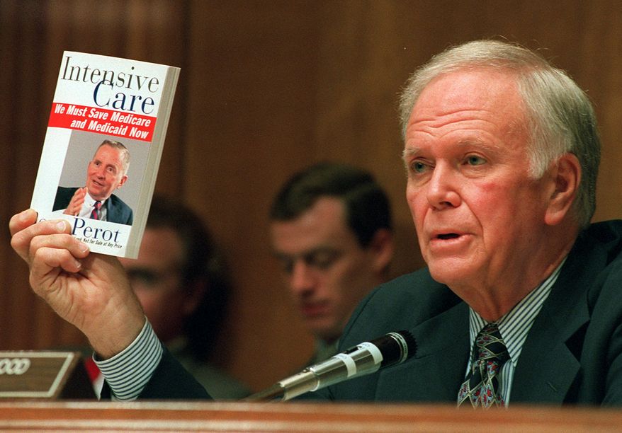 Senate Finance Committee Chairman Bob Packwood, R-Ore., holds a book entitled "Intensive Care" by Ross Perot, during hearings dealing with the future of Medicare on Capitol Hill, Aug. 30, 1995. (AP Photo/Dennis Cook, File)