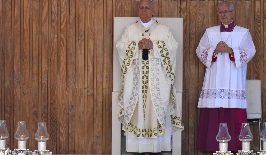 Pope Leo XIV presides over a Mass marking the Catholic feast of Corpus Christi at Plaza de Cibeles in Madrid, Spain, Sunday, June 7, 2026, on the second day of his seven-day apostolic visit to mainland Spain and the Canary Islands. (AP Photo/Manu Fernandez)