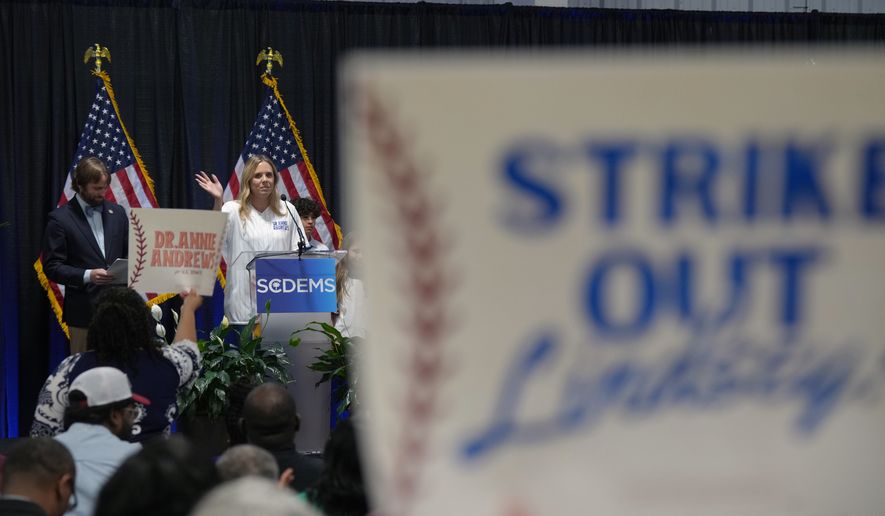 Dr. Annie Andrews, a Democrat running against Sen. Lindsey Graham, R-S.C., waves from the stage at the South Carolina Democratic Party Convention, Saturday, May 30, 2026, in Columbia, S.C. (AP Photo/Meg Kinnard)