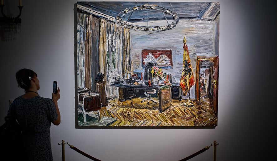 A person takes a photo of the painting "Im Buero des Bundespraesidenten" (In the office of the Federal President), by Christopher Lehmpfuhl, during the press preview of an exhibition of contemporary art at the German President's residency, Bellevue Palace, in Berlin, Germany, Monday, June 8, 2026. (AP Photo/Markus Schreiber)