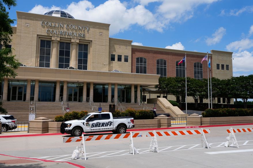 A Collin County seriff drives past the front of the county courthouse Thursday, June 4, 2026, in McKinney, Texas. (AP Photo/Tony Gutierrez)