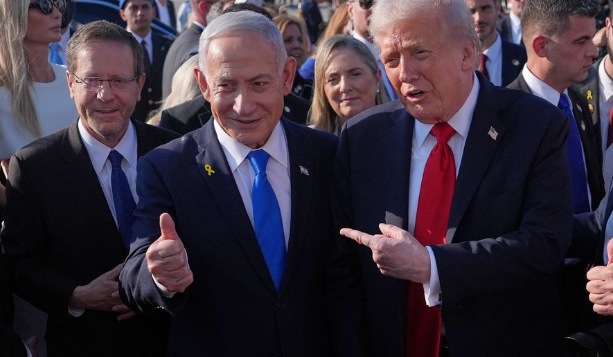 FILE - President Donald Trump poses for a photo with Israel's Prime Minister Benjamin Netanyahu before he boards Air Force One at Ben Gurion International Airport, Oct. 13, 2025, near Tel Aviv, as Israel's President Isaac Herzog watches at left. (AP Photo/Evan Vucci, File)