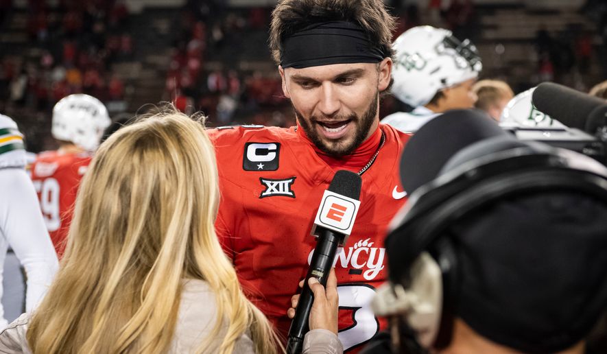 FILE - Cincinnati quarterback Brendan Sorsby (2) is interviewed after a NCAA college football game against Baylor, Oct. 25, 2025, in Cincinnati. (AP Photo/Tanner Pearson, File)