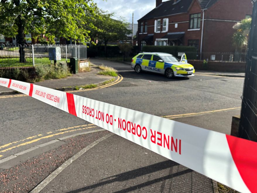 A police cordon at the scene of a stabbing outside apartments in north Belfast, Tuesday, June 3, 2026. (Rebecca Black/PA via AP)
