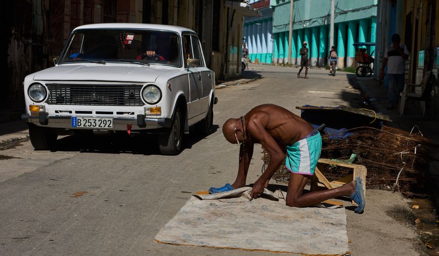 A man repairs a mattress in Havana, Cuba, Tuesday, June 9, 2026. (AP Photo/Ramon Espinosa)