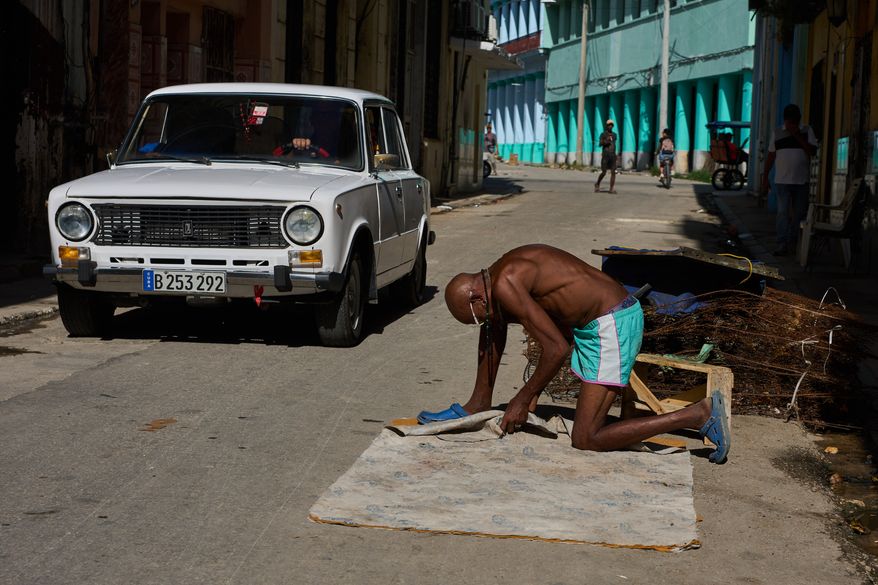A man repairs a mattress in Havana, Cuba, Tuesday, June 9, 2026. (AP Photo/Ramon Espinosa)