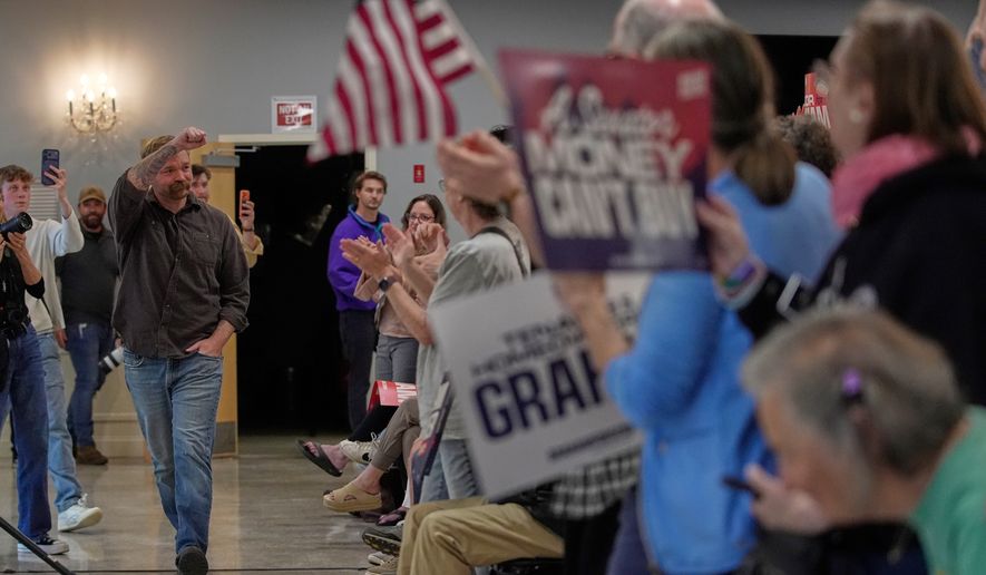 Graham Platner, Democratic candidate for U.S. Senate, acknowledges applause at a campaign event Sunday, June 7, 2026, in Portland, Maine. (AP Photo/Robert F. Bukaty)