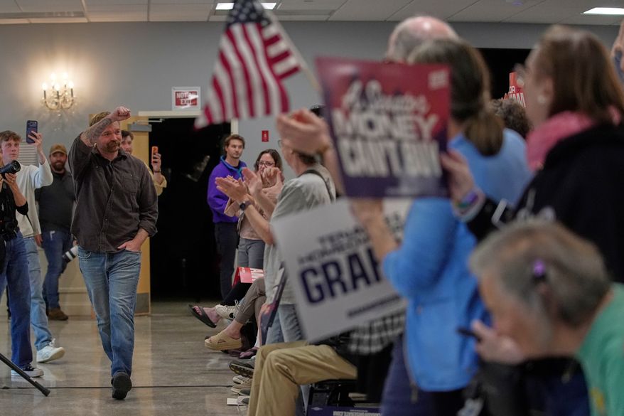 Graham Platner, Democratic candidate for U.S. Senate, acknowledges applause at a campaign event Sunday, June 7, 2026, in Portland, Maine. (AP Photo/Robert F. Bukaty)