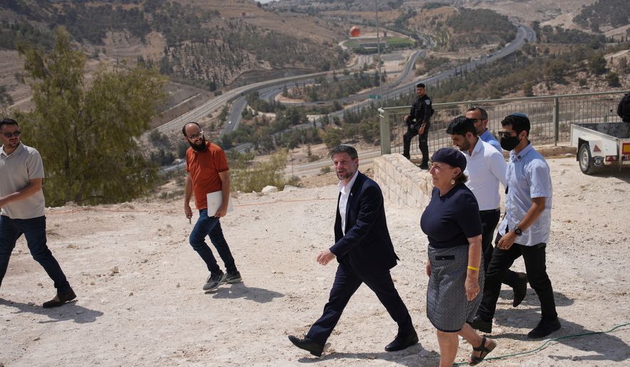 FILE - Israeli Finance Minister Bezalel Smotrich arrives for a news conference about new settlement construction in the Israel-occupied West Bank near Maale Adumim, Aug. 14, 2025. (AP Photo/Ohad Zwigenberg, File)