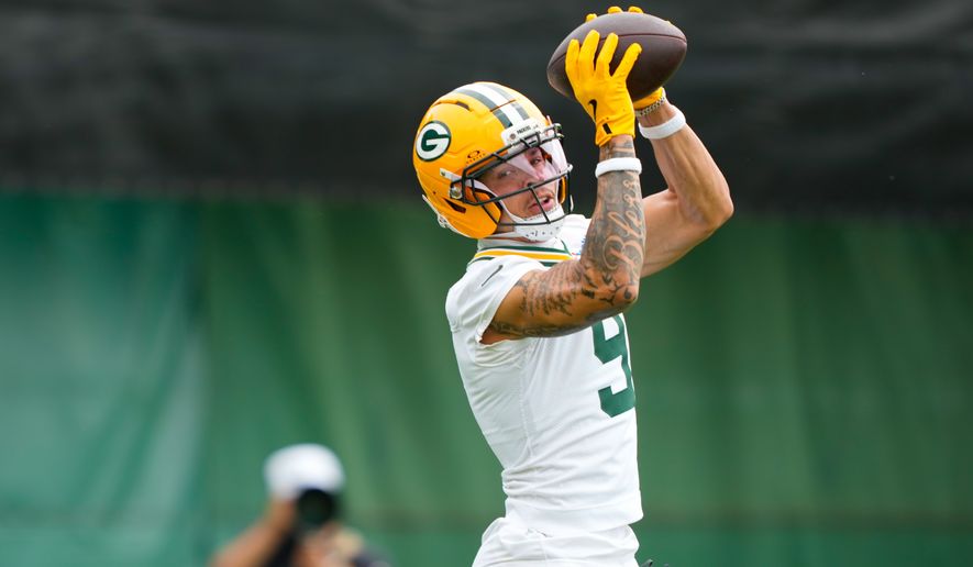 Green Bay Packers wide receiver Christian Watson works out during NFL football practice, Tuesday, June 9, 2026, in Green Bay, Wis. (AP Photo/Kayla Wolf)