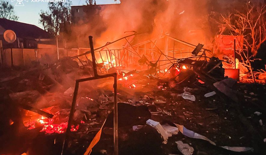 In this photo provided by the Ukrainian Emergency Services on Tuesday, June 9, 2026, a damaged building burns after a Russian strike in Kharkiv, Ukraine. (Ukrainian Emergency Service via AP)