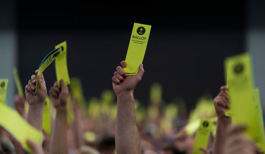 Attendees hold up their ballots during the Southern Baptist Convention's annual meeting in Anaheim, Calif., June 14, 2022. (AP Photo/Jae C. Hong, File)
