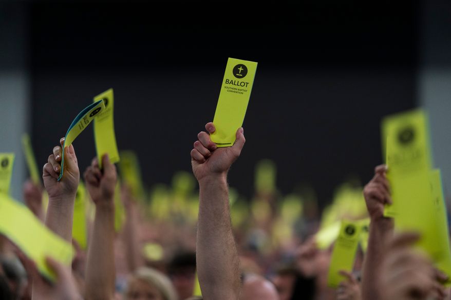 Attendees hold up their ballots during the Southern Baptist Convention's annual meeting in Anaheim, Calif., June 14, 2022. (AP Photo/Jae C. Hong, File)