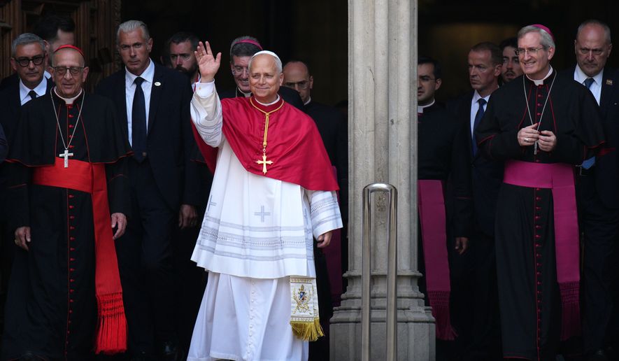 Pope Leo XIV waves to the cheering crowd after attending a midday prayer at the Cathedral of the Holy Cross and Saint Eulalia in Barcelona, Spain, Tuesday, June 9, 2026. (AP Photo/Emilio Morenatti)