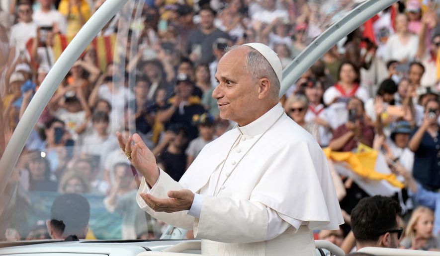 Pope Leo XIV makes a six-seven hand gestures as he arrives to attend a prayer vigil at Lluis Companys Olympic Stadium in Barcelona, Spain, Tuesday, June 9, 2026. (AP Photo/Bernat Armangue)