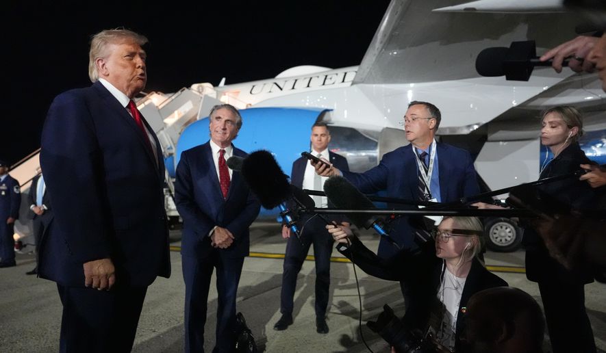President Donald Trump talks with reporters before boarding Air Force One at John F. Kennedy International Airport in New York, early Tuesday, June 9, 2026. (AP Photo/Mark Schiefelbein)