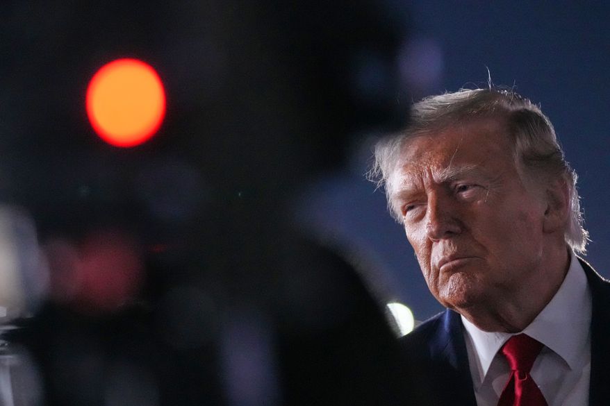 President Donald Trump talks with reporters before boarding Air Force One at John F. Kennedy International Airport in New York, early Tuesday, June 9, 2026. (AP Photo/Mark Schiefelbein)