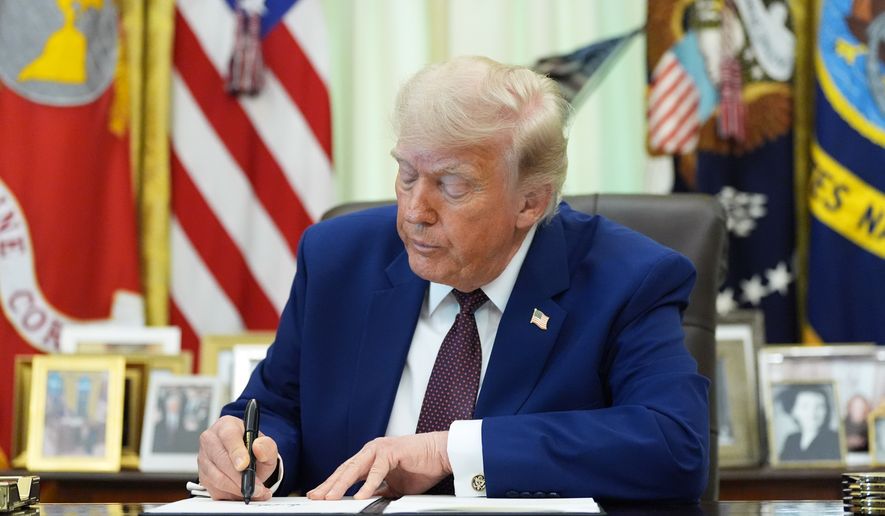 President Donald Trump signs an executive order in the Oval Office of the White House, Wednesday, June 3, 2026, in Washington. (AP Photo/Alex Brandon)