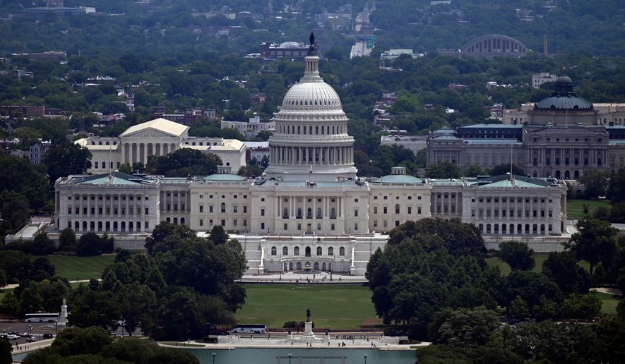 The west front of the U.S. Capitol with the Supreme court on the left and the Library of Congress on the right, is seen from the top of the Washington Monument , Saturday, June 6, 2026, in Washington. (AP Photo/John McDonnell)