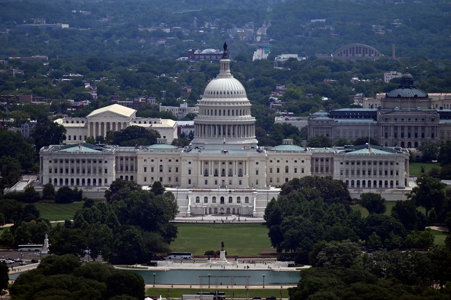 The west front of the U.S. Capitol with the Supreme court on the left and the Library of Congress on the right, is seen from the top of the Washington Monument , Saturday, June 6, 2026, in Washington. (AP Photo/John McDonnell)