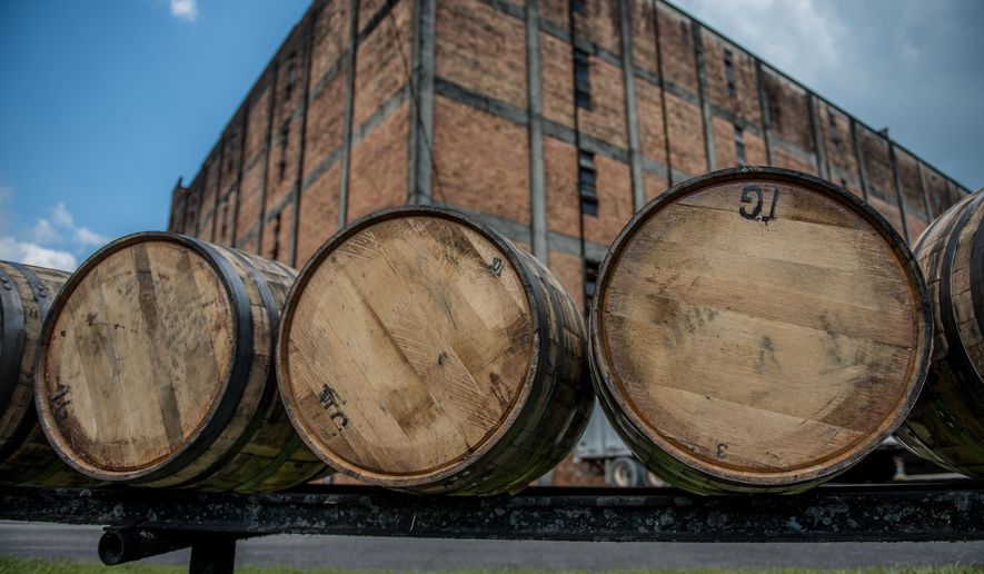 Bourbon barrels at a distillery along the Bourbon Trail in Kentucky. File photo credit: thomas carr via Shutterstock.
