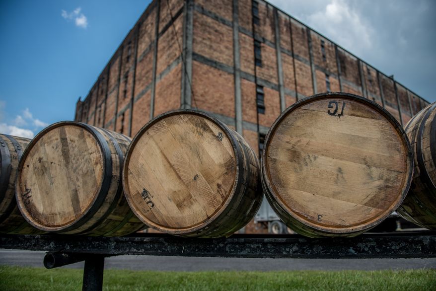 Bourbon barrels at a distillery along the Bourbon Trail in Kentucky. File photo credit: thomas carr via Shutterstock.